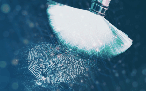 Brush that is dusting for fingerprints. Fingerprint is shown, implying that a unique value has been uncovered.