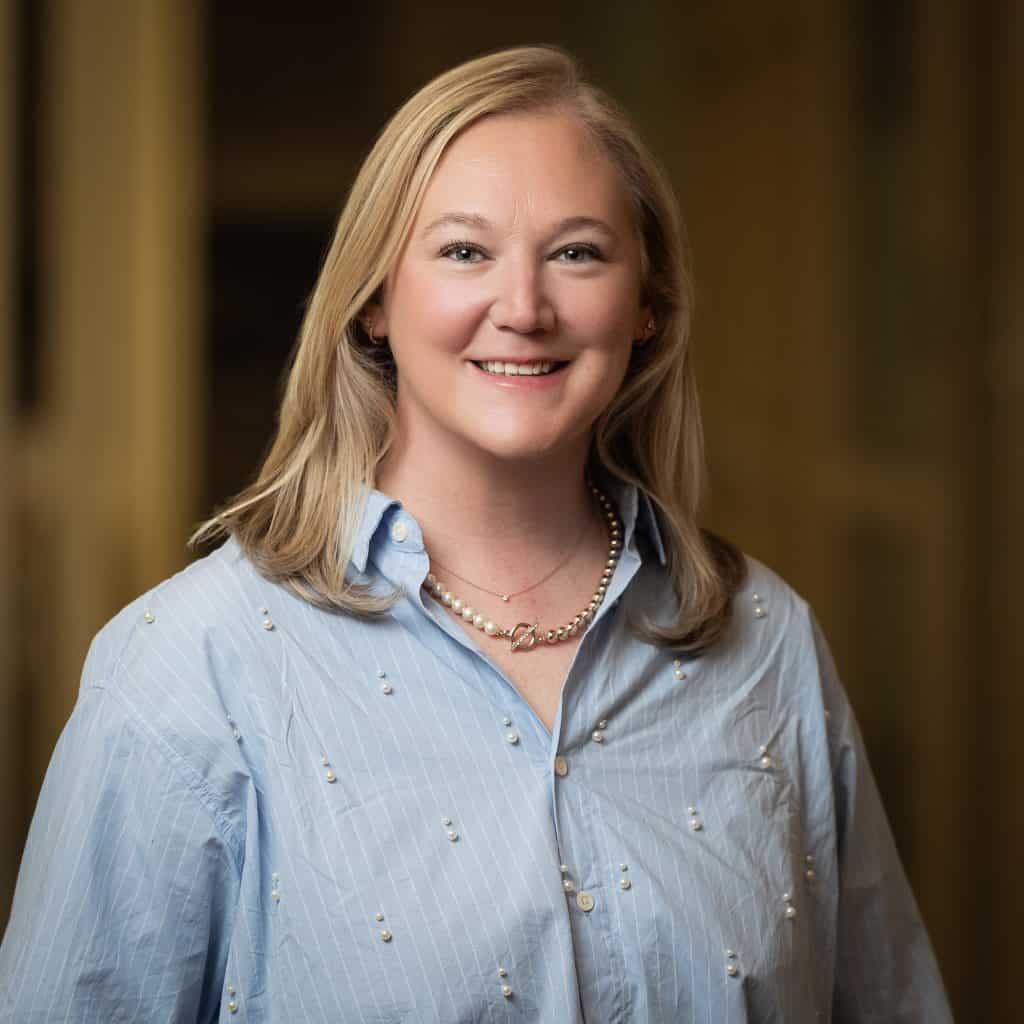Cybersecurity professional woman smiling in an office, emphasizing data security and threat preventi.