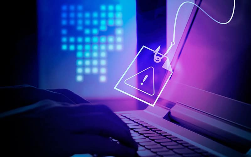 Suspicious online security warning alert on a laptop screen, representing cyber threat detection.