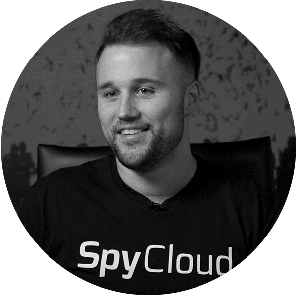 Cybersecurity professional wearing a SpyCloud shirt, showcasing data breach prevention expertise.