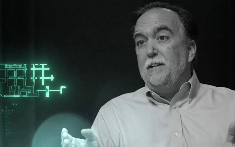 Cybersecurity expert analyzing threat data on digital screen.