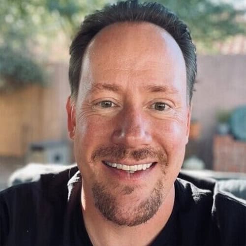 Smiling man at Black Hat 2026 cybersecurity event.