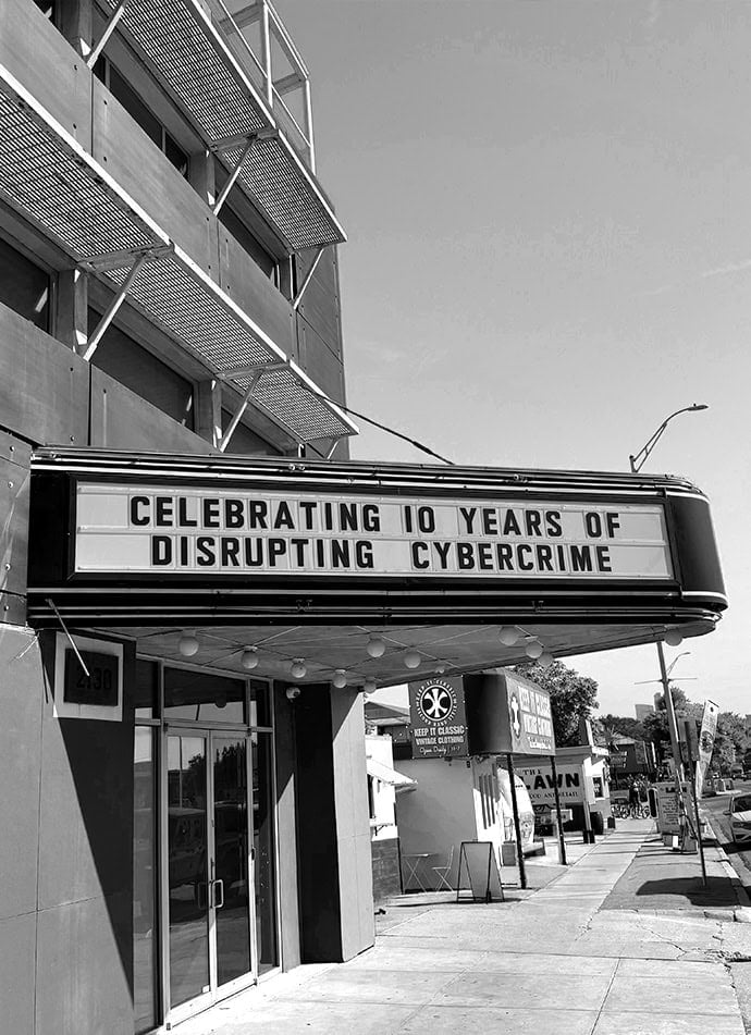 Marquee sign celebrating a decade of cybercrime disruption at SpyCloud.