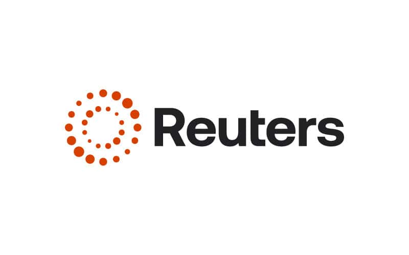 Reuters news agency logo with orange dots and black text.